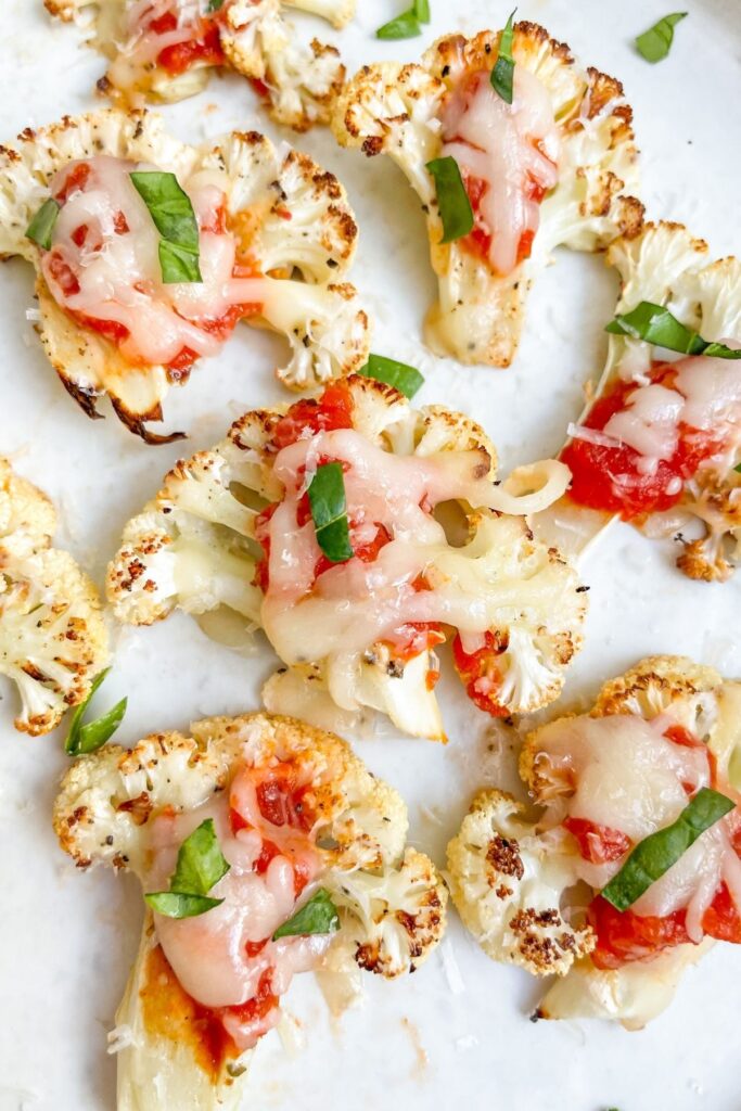 Best ever low carb cauliflower pizza bites made with 6 simple ingredients! You'll seriously love these healthy pizza bites recipe as an appetizer or dinner side dish. They are nutritious, kid-friendly, and irresistibly delicious!