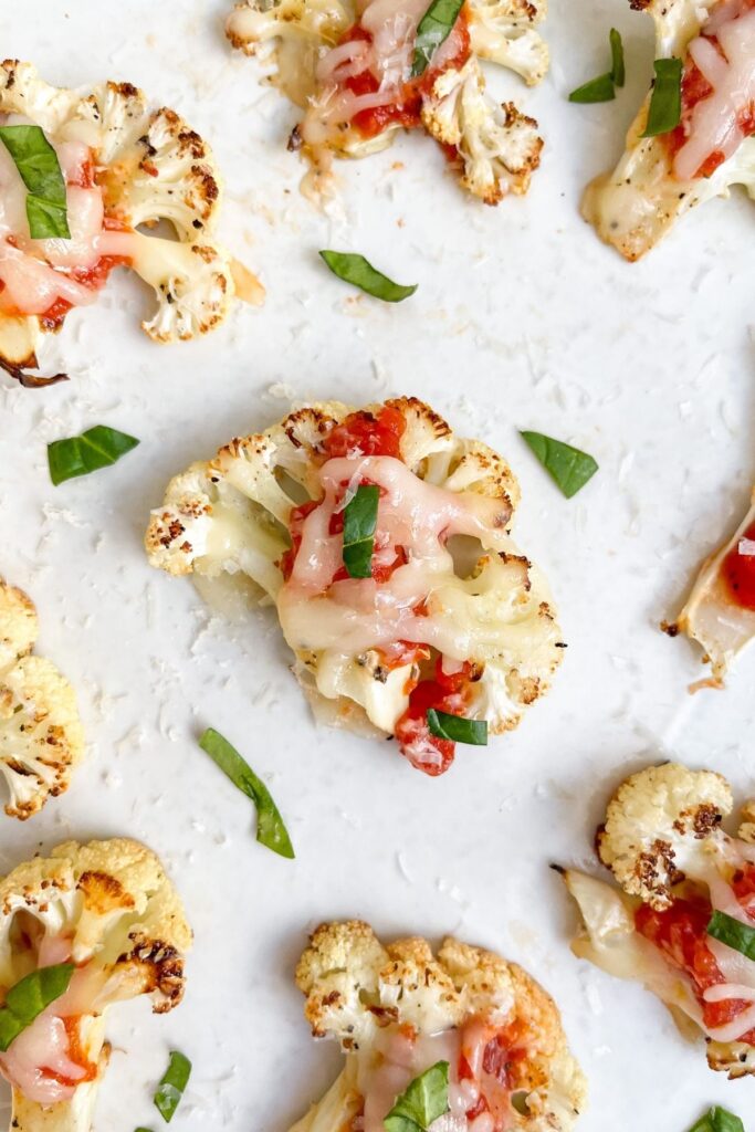 Low carb pizza bites made out of cauliflower! So delicious and kid friendly. Ready in 25 minutes, gluten free, and vegetarian!