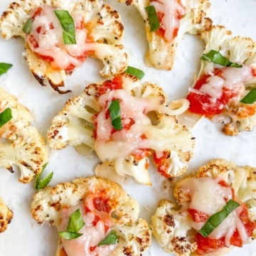 Best ever low carb cauliflower pizza bites made with 6 simple ingredients! You'll seriously love these healthy pizza bites recipe as an appetizer or dinner side dish. They are nutritious, kid-friendly, and irresistibly delicious!