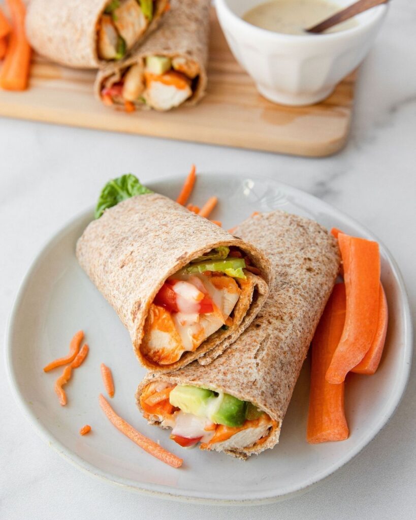 Easy, healthy, quick homemade buffalo chicken caesar wraps. Paleo buffalo chicken recipe that everyone will love! Easy to make and perfect for fitness lovers.