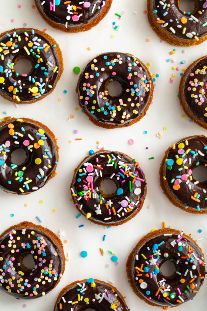 Baked healthy chocolate frosted donuts with sprinkles.