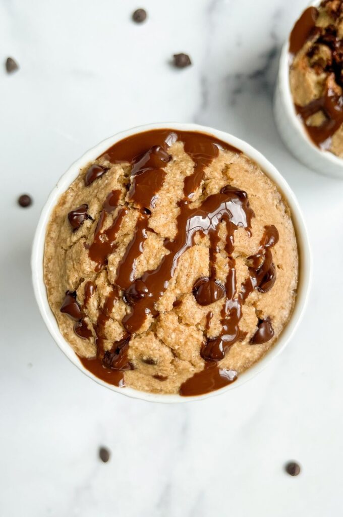 fluffy high protein baked oats with a chocolate drizzle