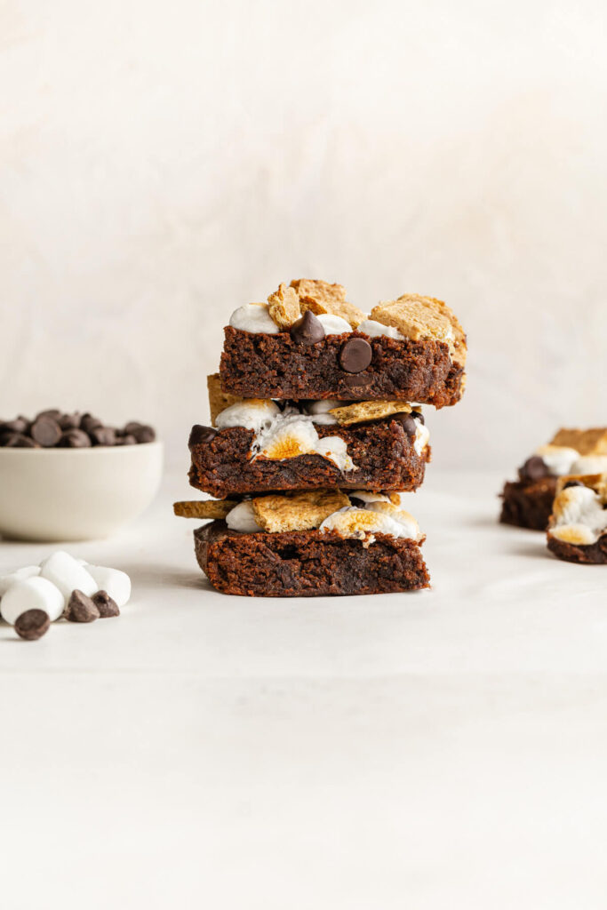three healthy s'mores brownies stacked on top of each other