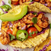 Healthy and easy al pastor shrimp tacos with pineapple and fresh carrot slaw