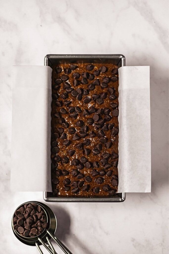 chocolate banana bread batter in a loaf tin