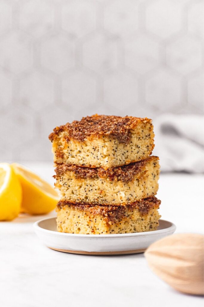 three pieces of healthy lemon poppy seed cake stacked on top of each other