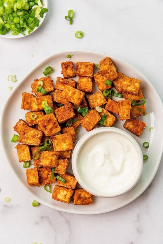 air fried tofu on a plate with dipping sauce