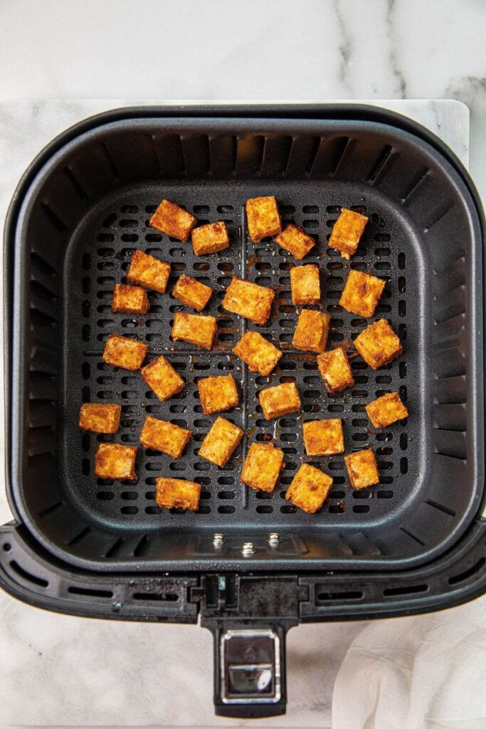 air fried crispy tofu in air fryer basket