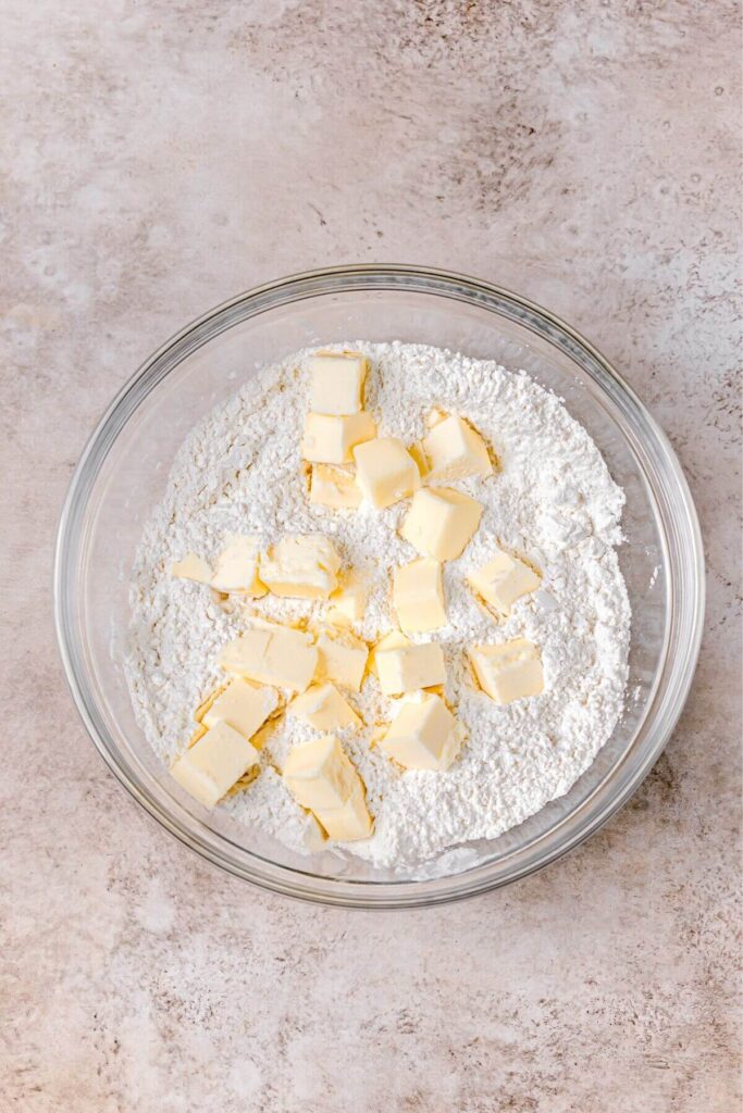 cold butter cubes in flour to make fluffy biscuits