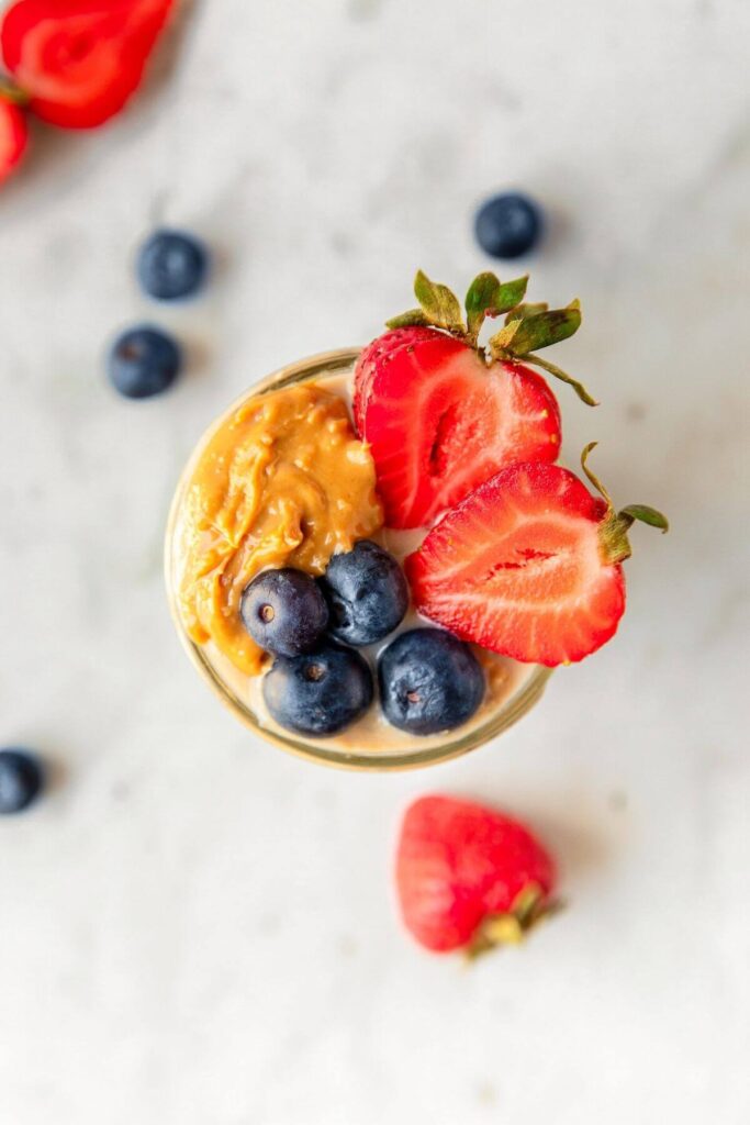 overnight oats with peanut butter, strawberries and blueberries