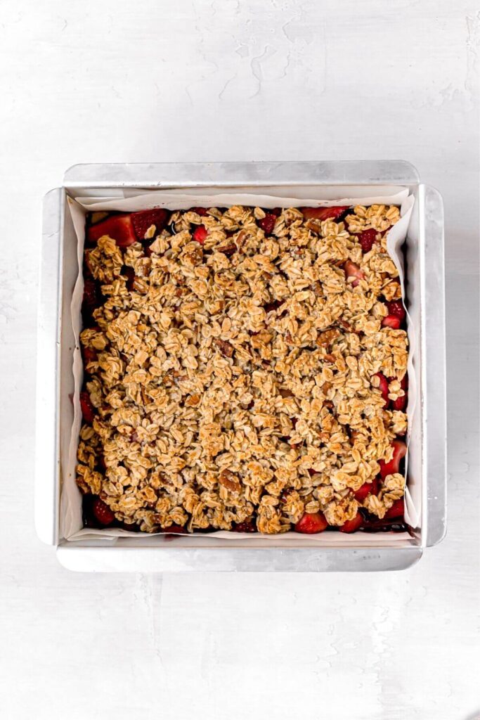 vegan strawberry crumble bars in baking pan