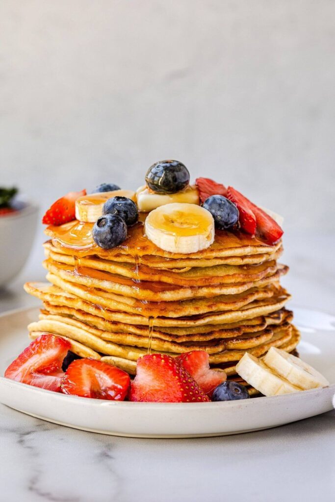 stack of fruit and oat milk pancakes