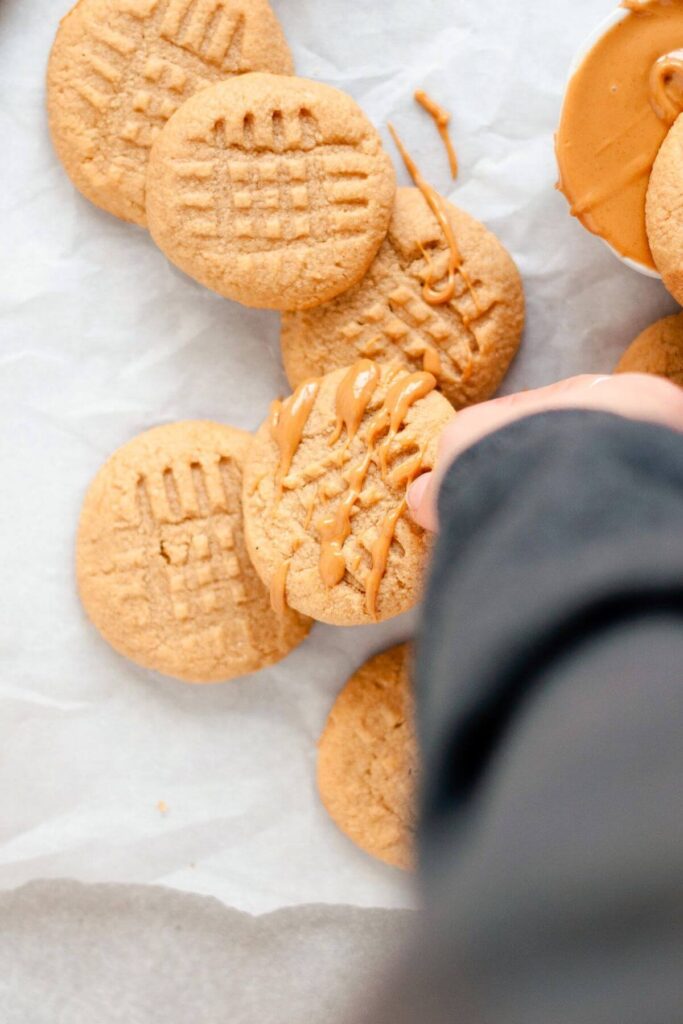 almond flour peanut butter cookies with peanut butter drizzled on top