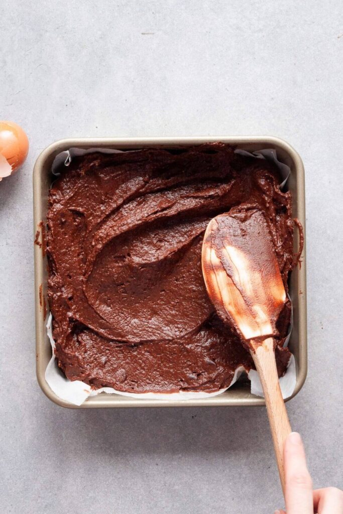brownie batter in a baking tin