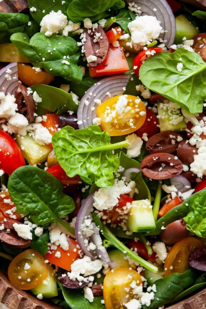spinach Greek salad with tomatoes, feta, and olives