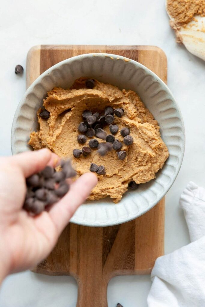 adding chocolate chips to protein chickpea cookie dough batter