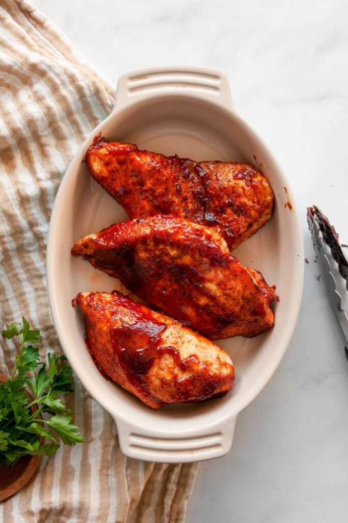 healthy air fried bbq chicken breasts in a dish