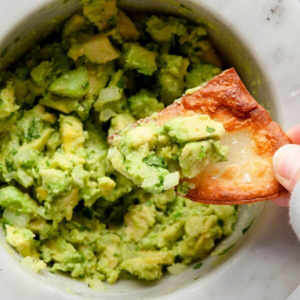 4 ingredient guacamole on a tortilla chip