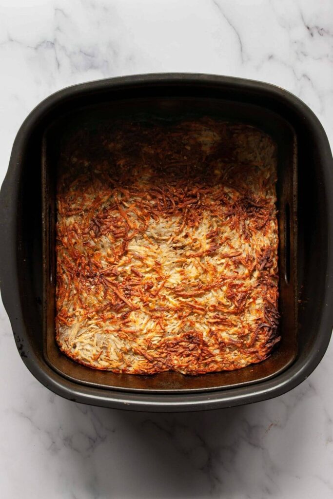 crispy shredded hash browns cooked inside air fryer basket