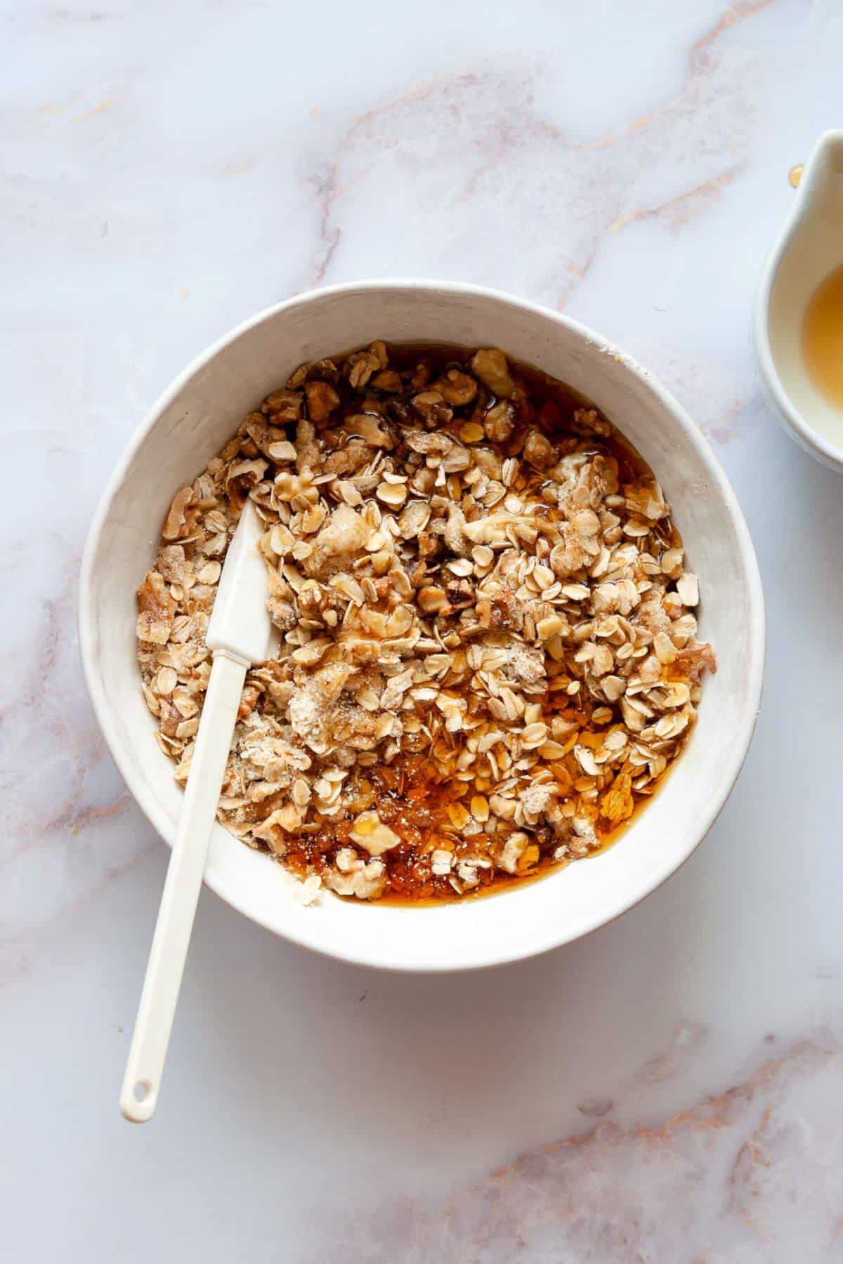 Crumble topping mixed together in a white bowl.