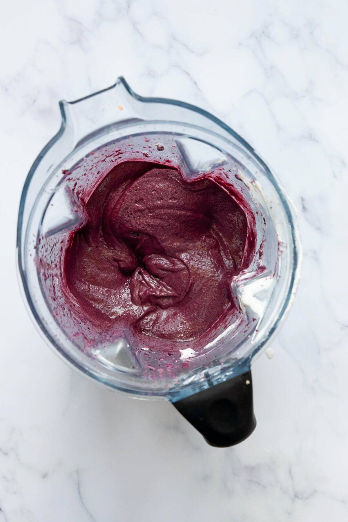 Blended high protein acai bowl base in a Vitamix blender showing thick, creamy soft-serve texture.
