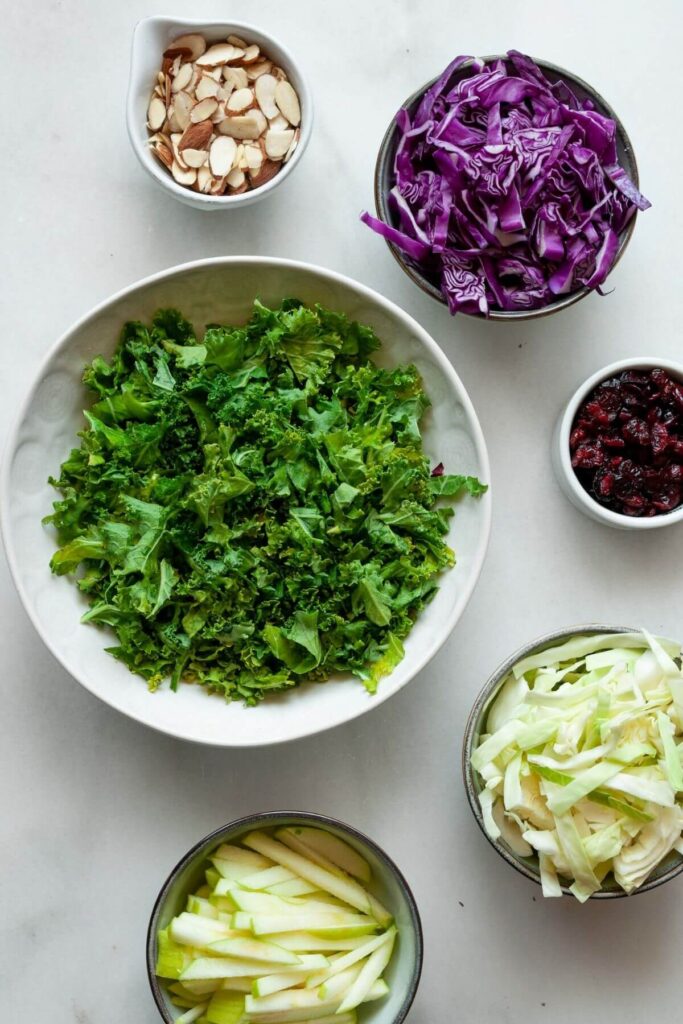 ingredients for kale crunch salad in small bowls