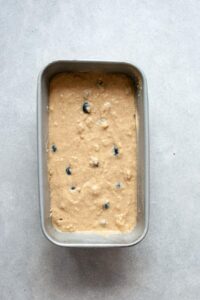 oil free blueberry banana bread batter in a loaf tin
