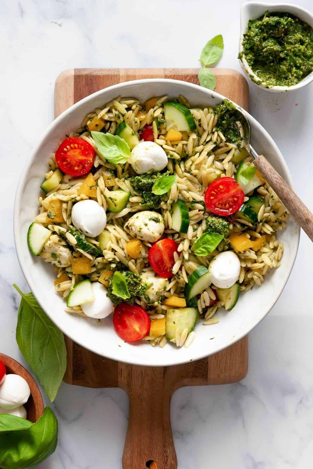 Caprese pesto orzo salad with fresh tomatoes and mozzarella