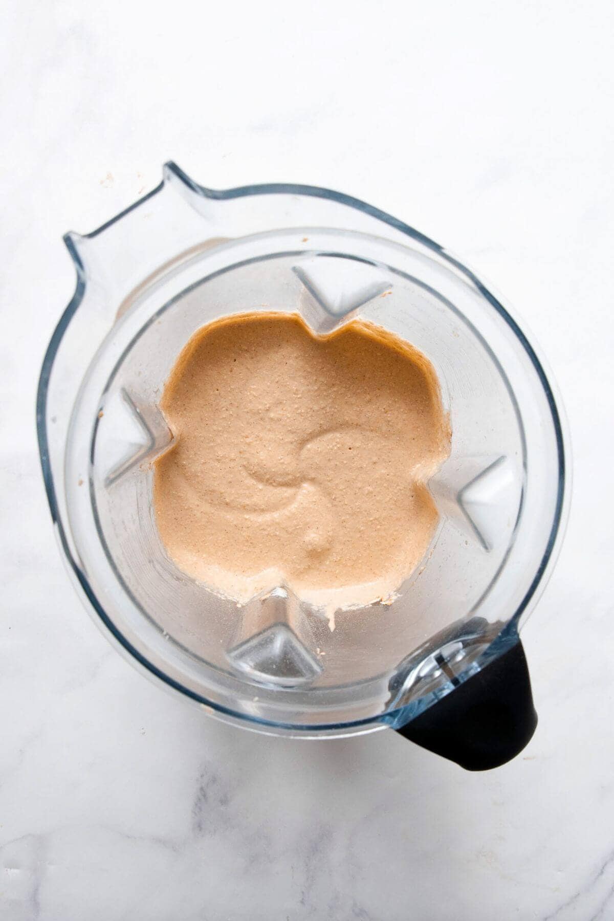 Smooth pumpkin protein pancake batter in a blender.