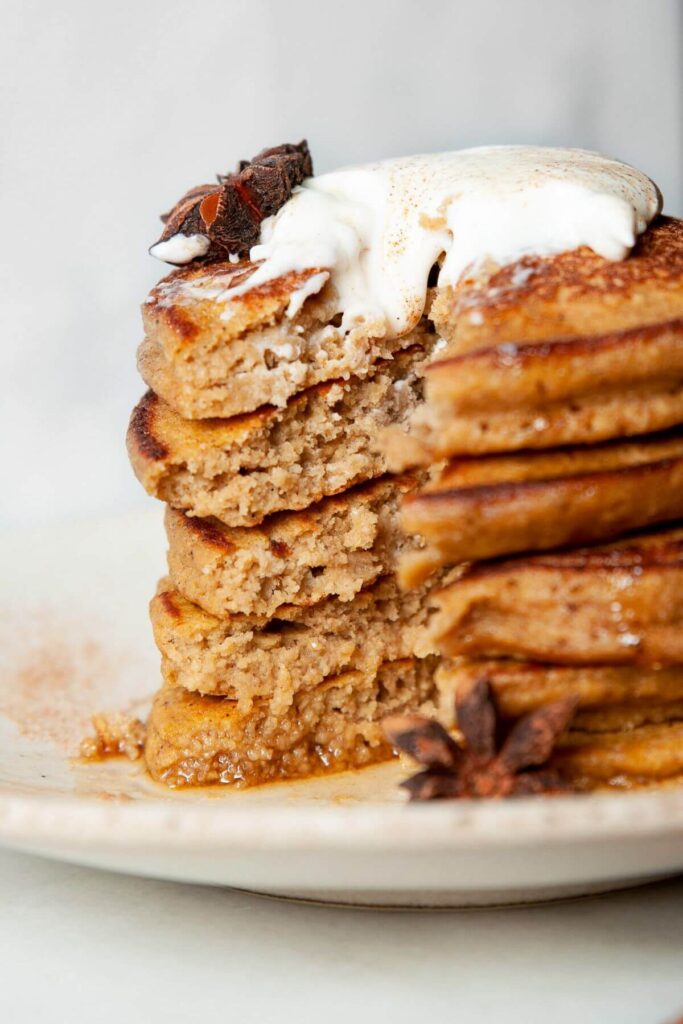 inside of a stack of 5 pumpkin protein pancakes to show fluffy and soft texture