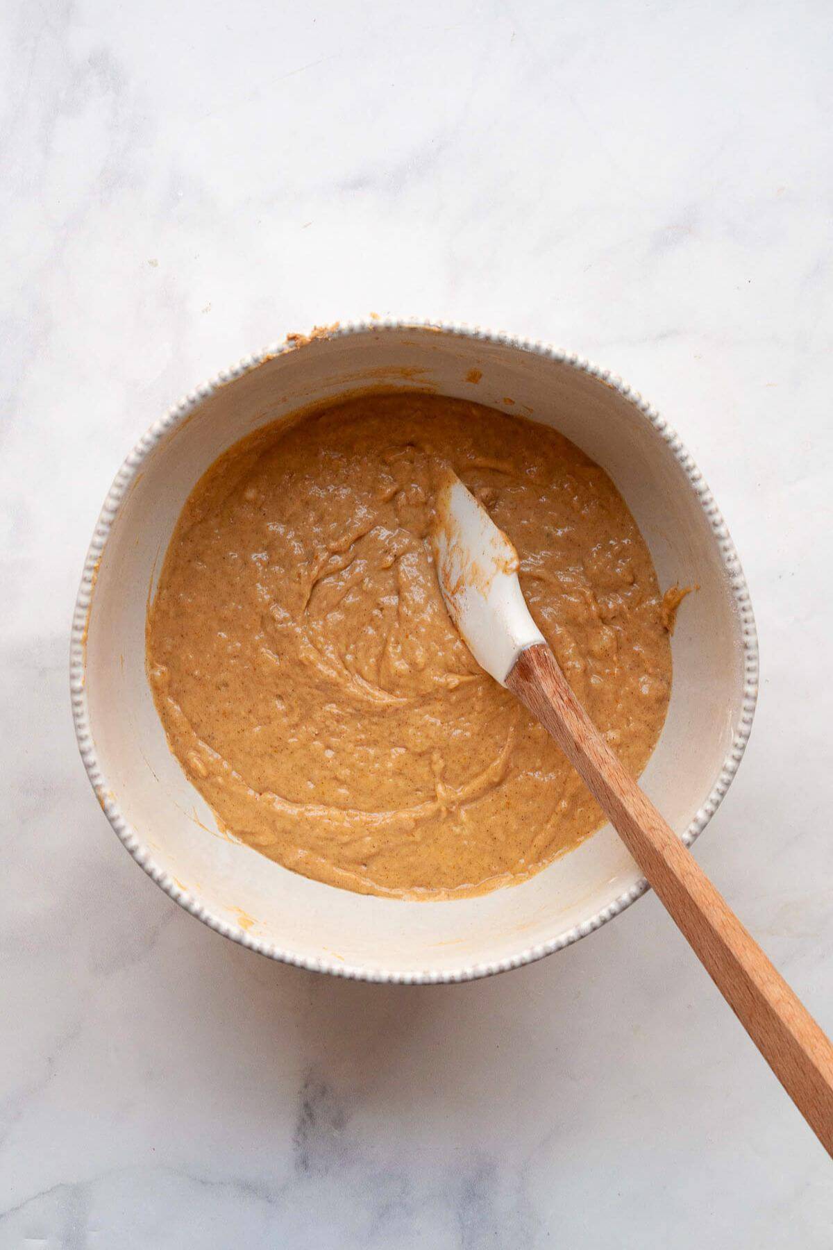 Banana pumpkin muffin batter in a large mixing bowl.