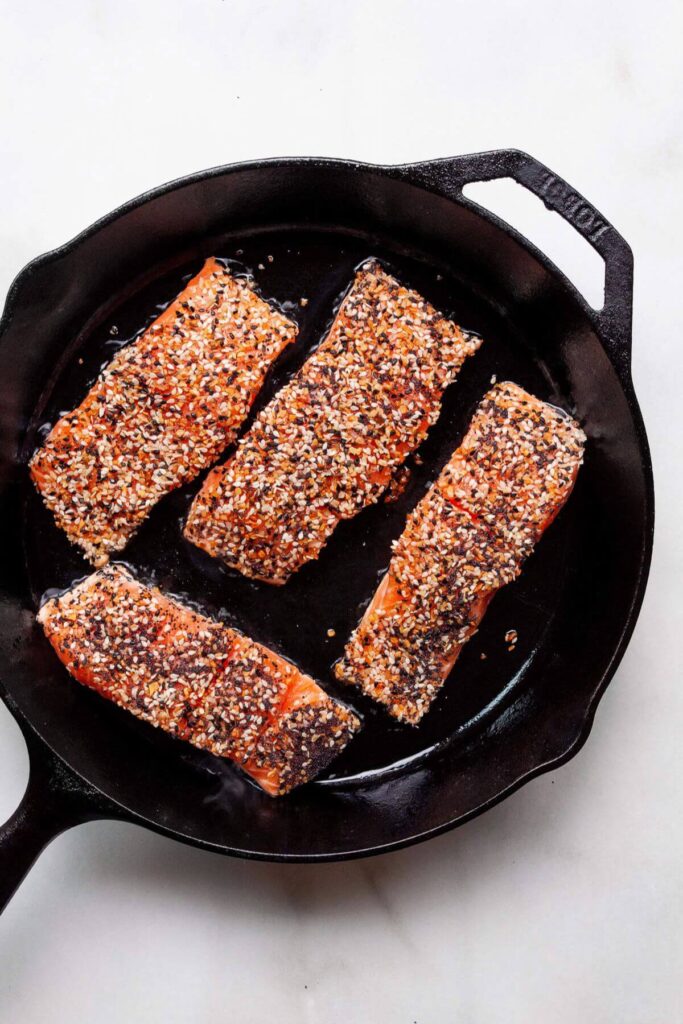 how to add everything bagel crusted salmon skin side down to hot pan