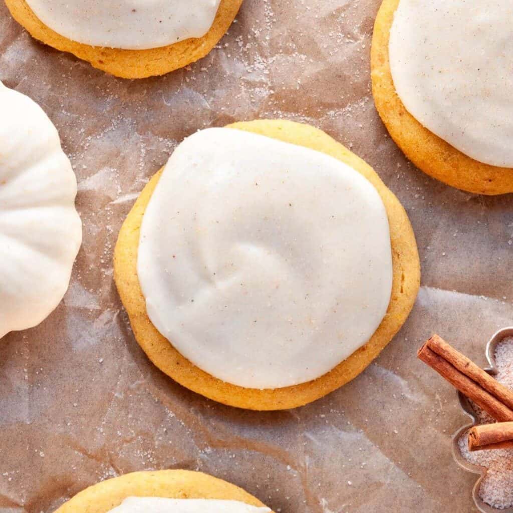 Soft, pillowy Lofthouse-style gluten-free pumpkin cookies topped with a lightened-up cream cheese frosting.