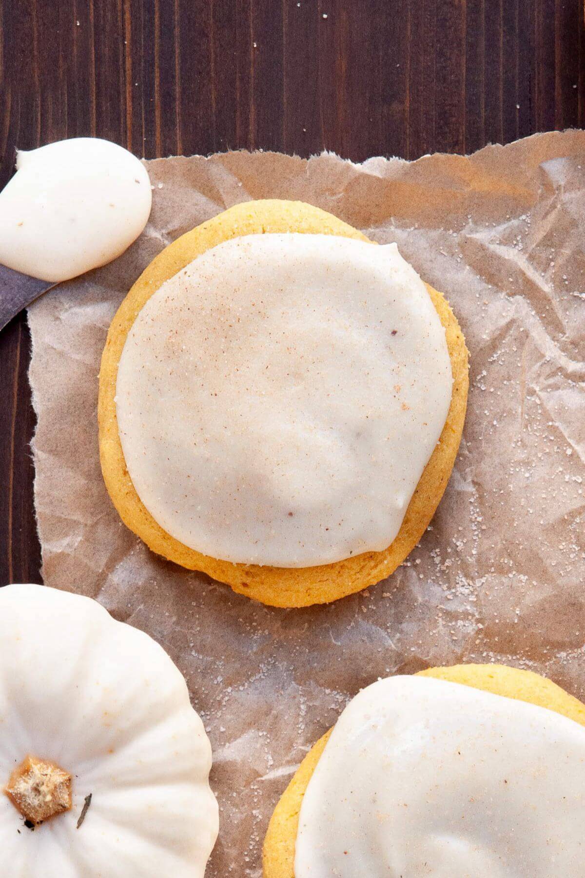 Frosting gluten-free pumpkin cookies with cream cheese frosting.