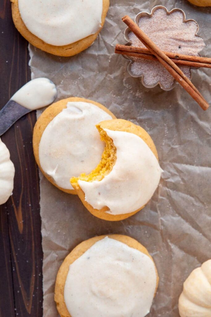 bite out of soft frosted pumpkin cookie