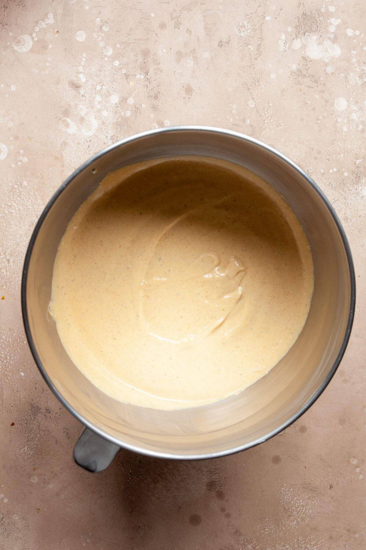 Pumpkin cheesecake batter with Greek yogurt in a bowl.