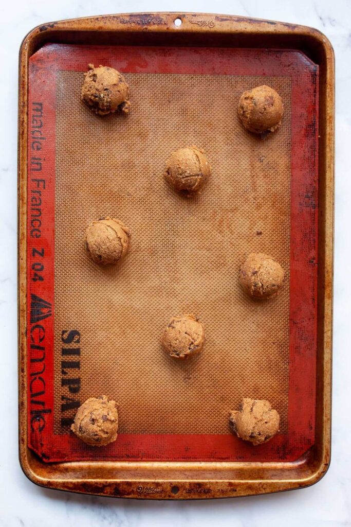 cookie dough balls on baking tray before making
