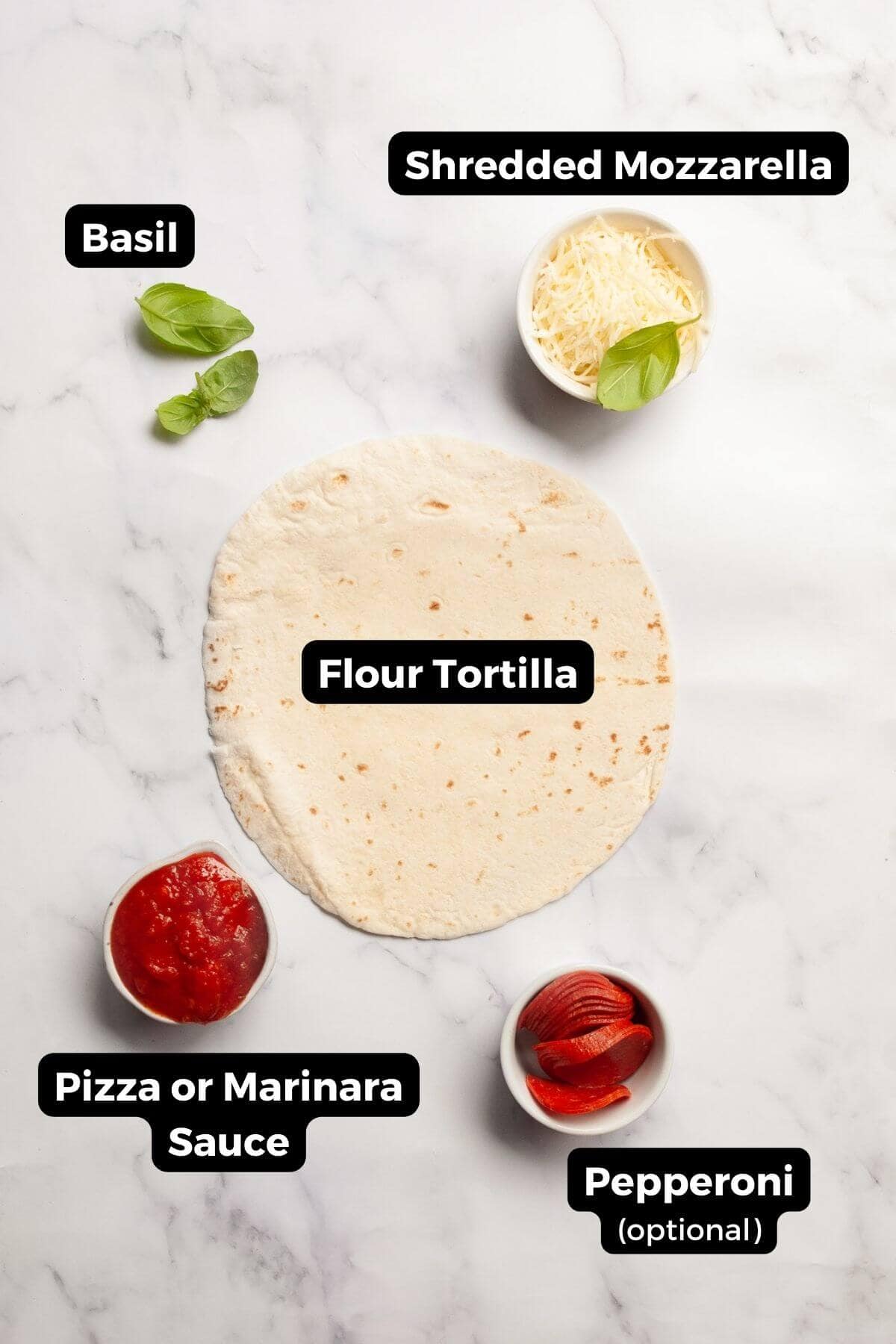 Ingredients for air fryer tortilla pizza including flour tortilla, pizza sauce, shredded mozzarella, and basil.