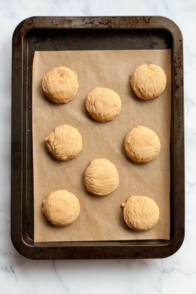 gingerbread cookies without molasses baked on a parchment lined baking sheet