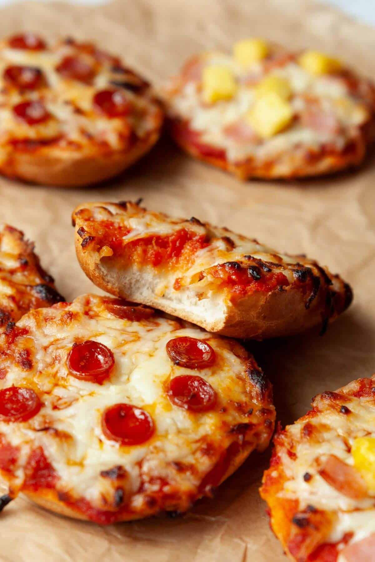 Close-up of pepperoni bagel bites with crispy edges and melted mozzarella.