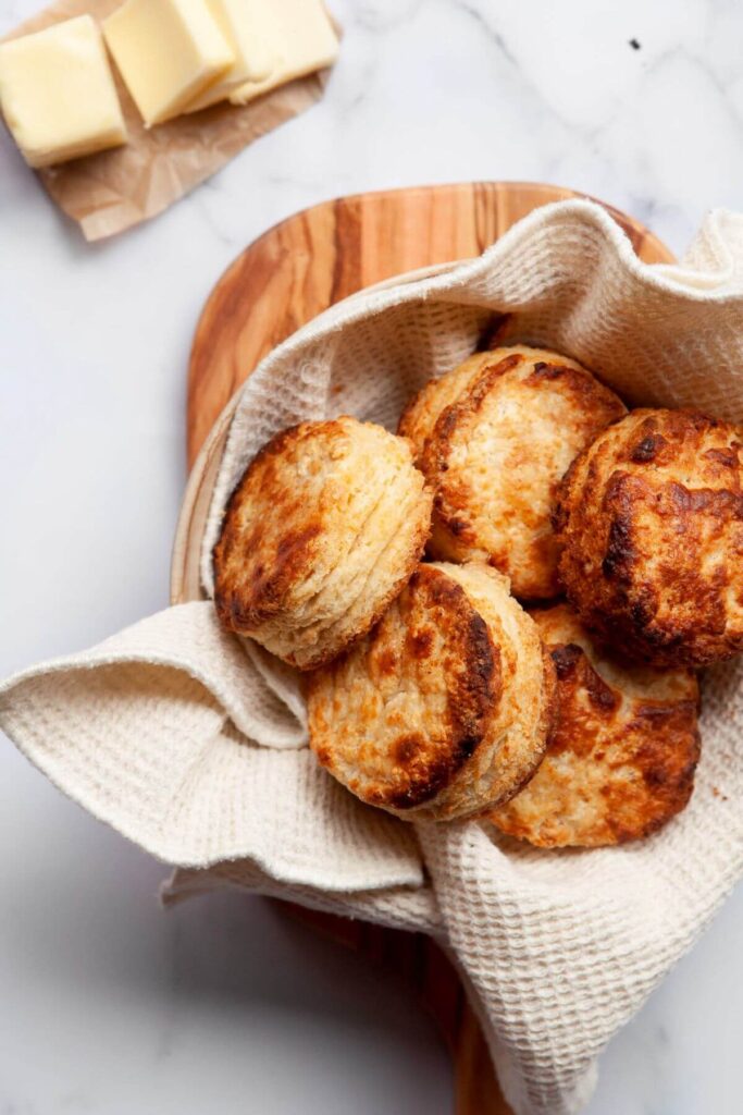 flaky buttery air fryer biscuits in a serving bowl
