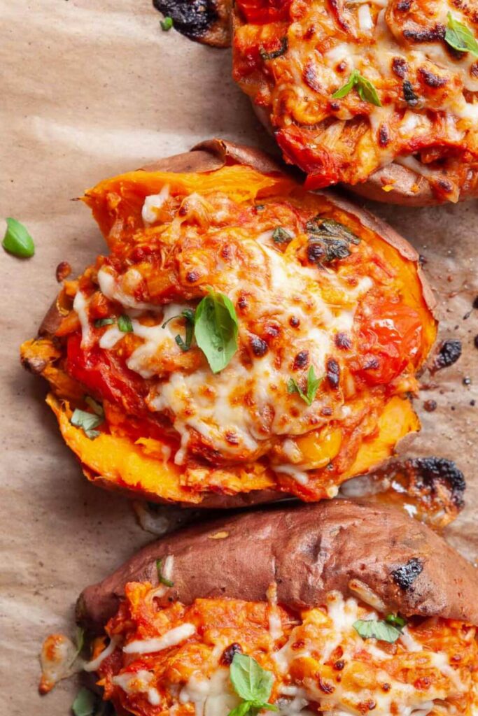close up of a cheesy chicken parm stuffed sweet potato boat