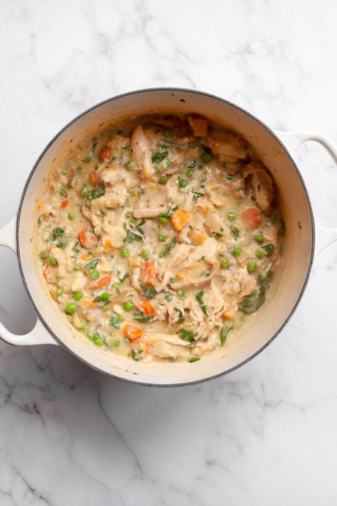 chicken pot pie soup in a large dutch oven
