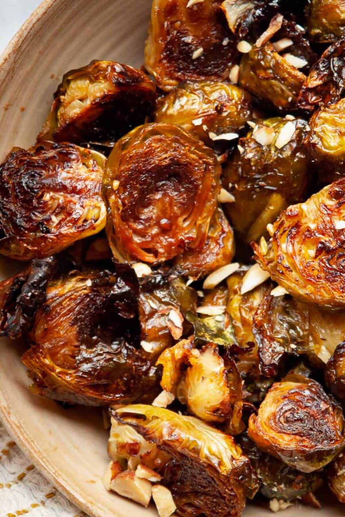 Close up of an extra crispy and tender maple balsamic glazed Brussels sprout.