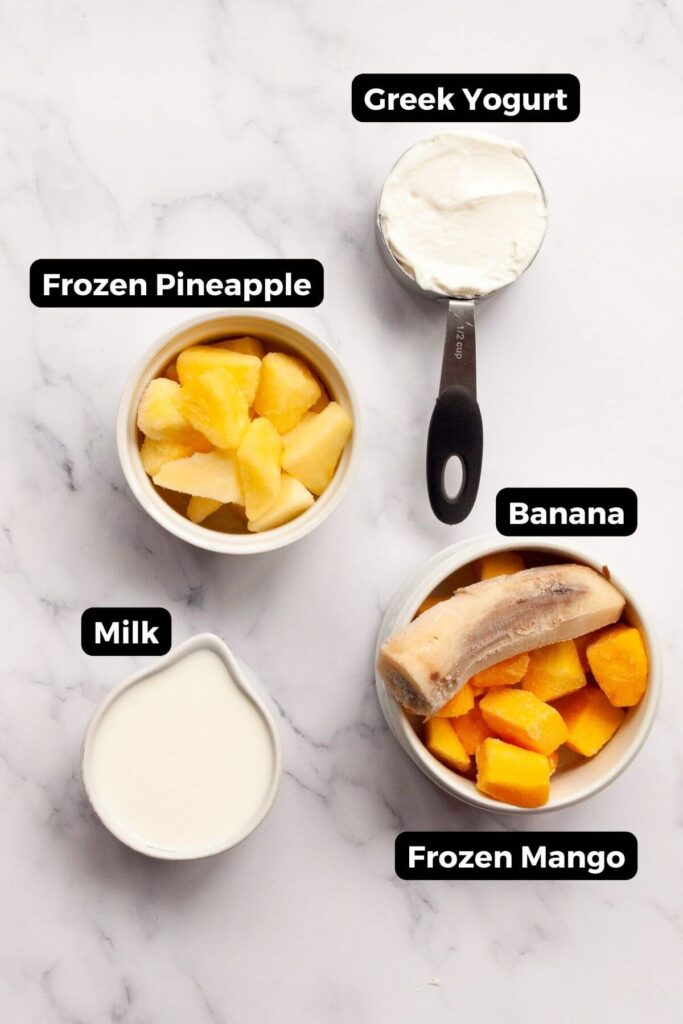 all the ingredients in this smoothie recipe in small bowls with labels