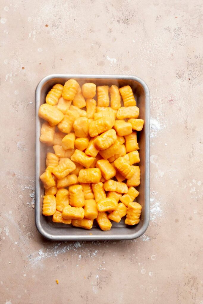 cooked sweet potato gnocchi on a tray