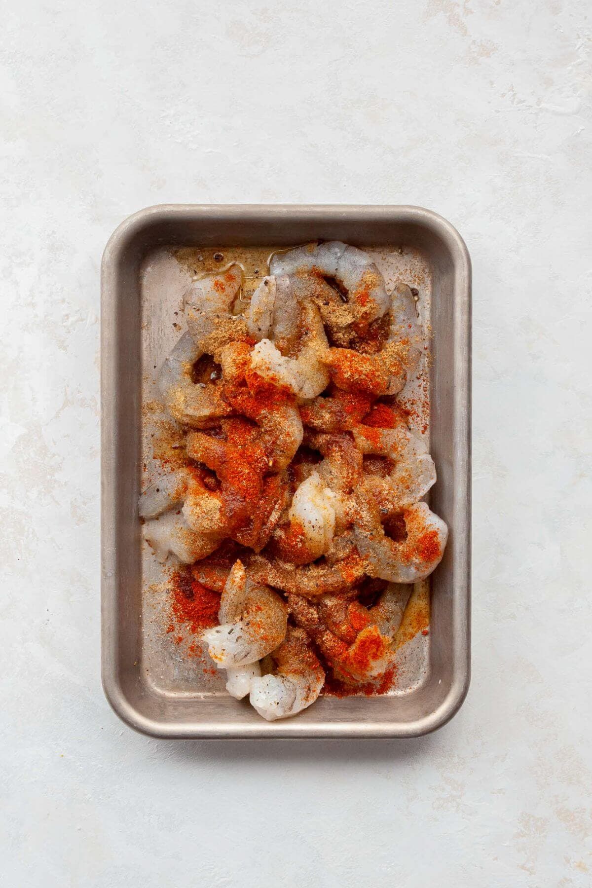 raw shrimp seasoned with Baja spices on a serving tray