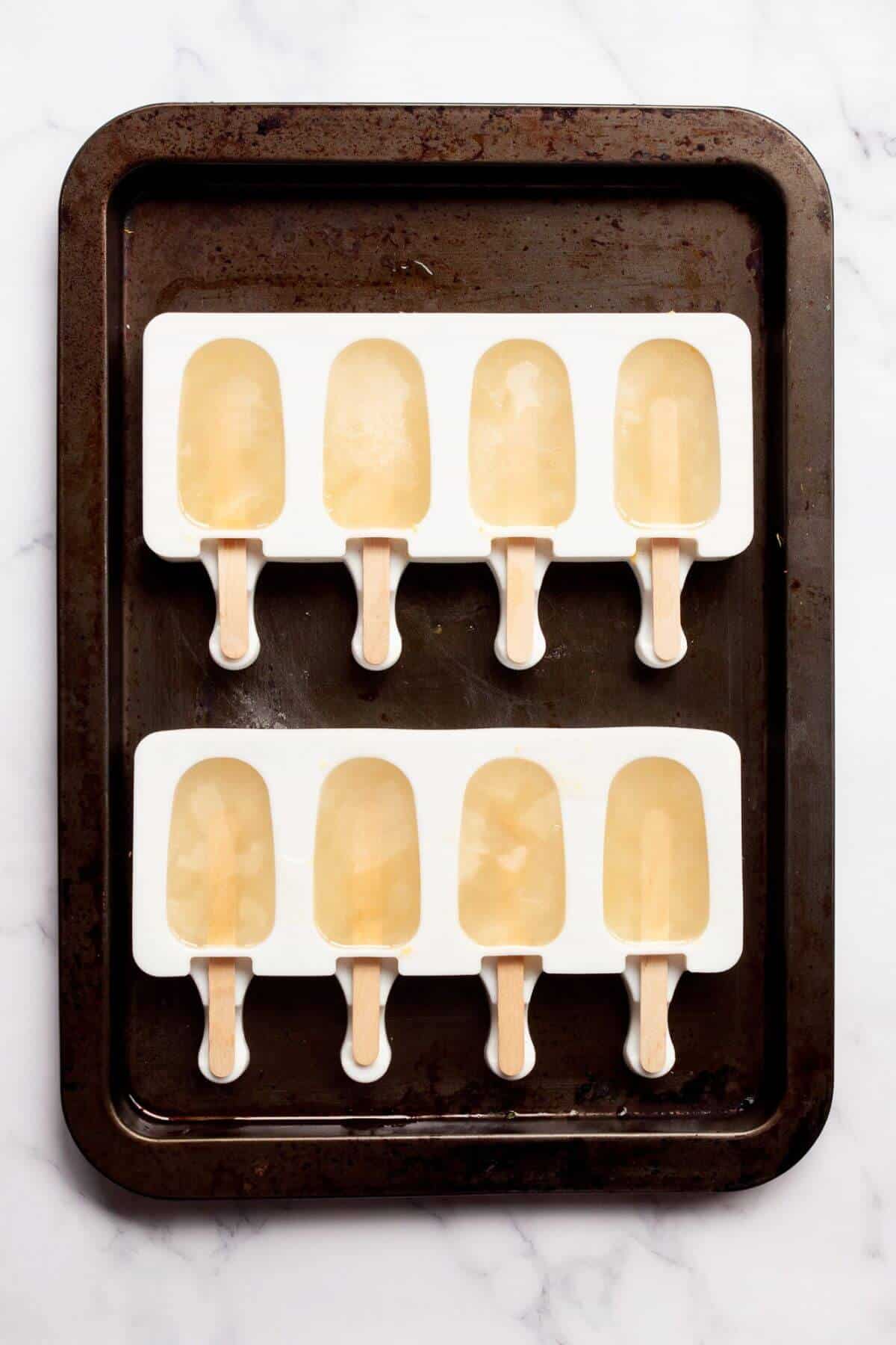 frozen lemonade popsicles in their molds