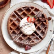 Nutella waffle with whipped cream and strawberries
