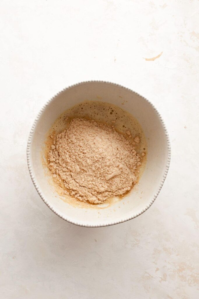 adding almond flour to wet ingredients